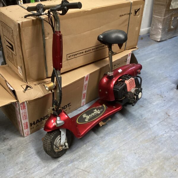 Vintage petrol scooter with a small engine, sold as seen.