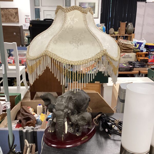 Vintage elephant table lamp with fringed shade.