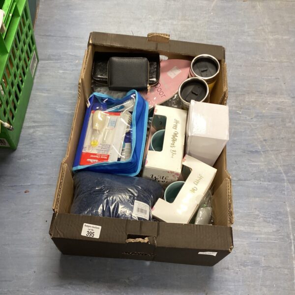 Mixed lot of baby care items and toiletries in a cardboard box.