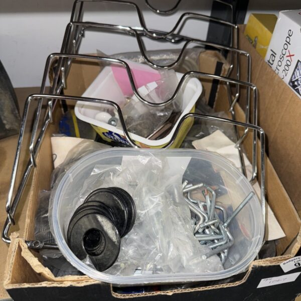 Assorted metal brackets and fixings from a shed clearance lot.