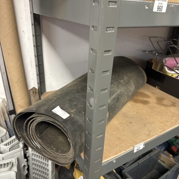 Roll of heavy-duty rubber matting for workshop flooring.