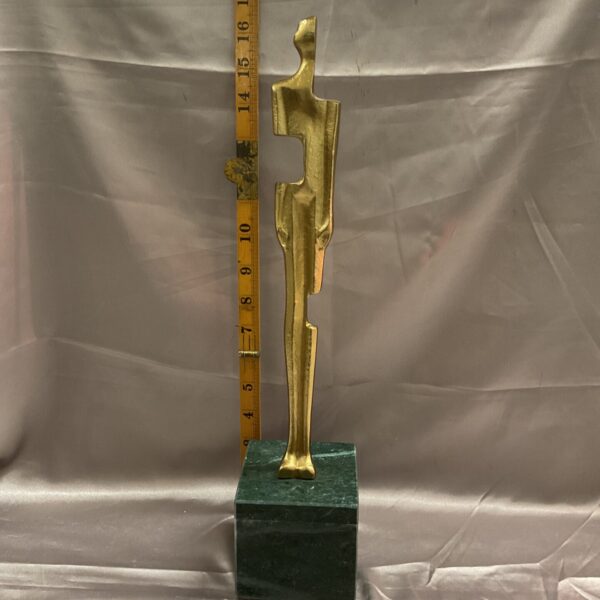 Vintage Giacometti style sculpture on a marble base, mid-century modern art.