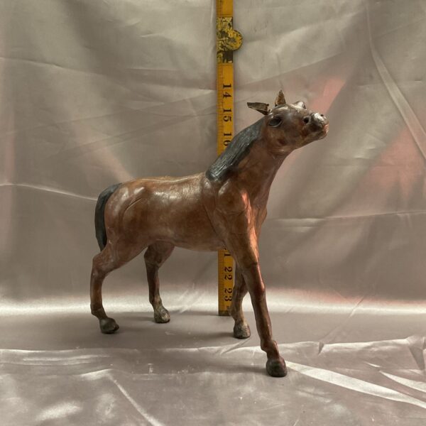 Vintage Liberty & Co leather horse sculpture, side view.