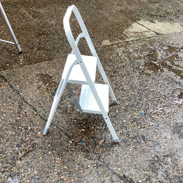 Vintage two-step kitchen ladder for reaching high shelves.