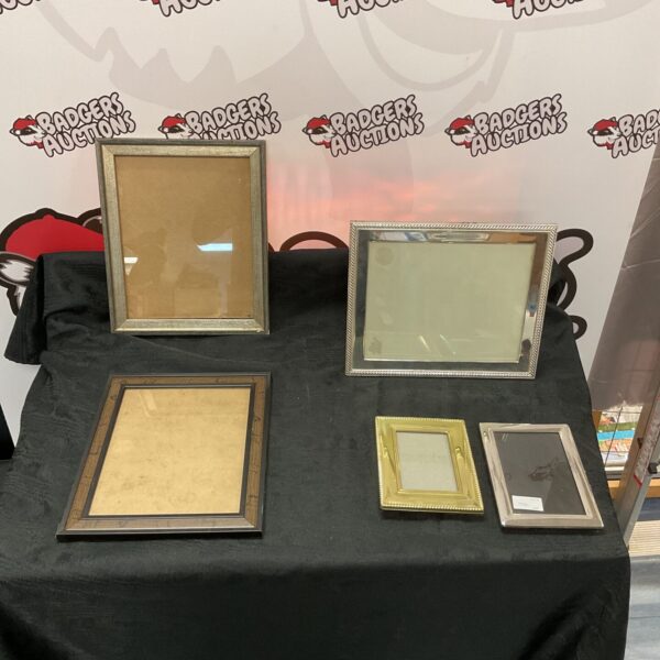 Assorted photo frames bundle for displaying pictures and artwork.