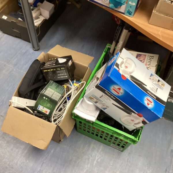 Bissell steam cleaner and mixed lot of household cleaning items.