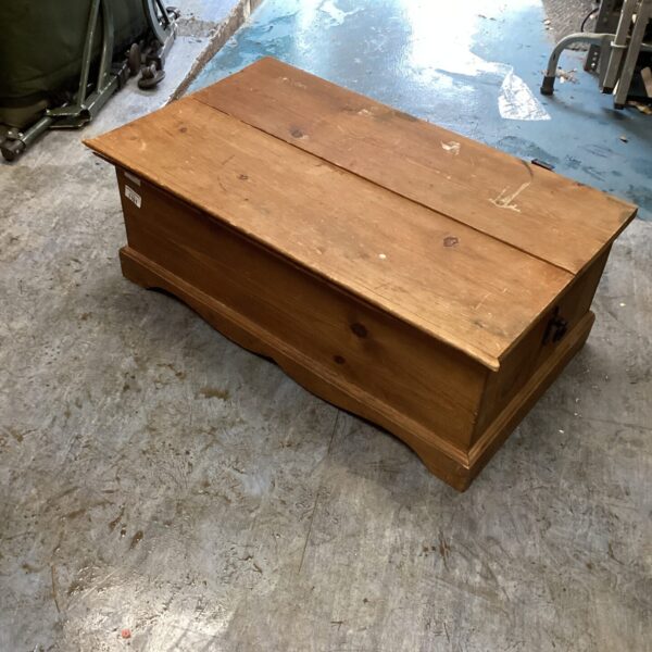 Vintage wooden chest with damaged lid, rustic storage solution.