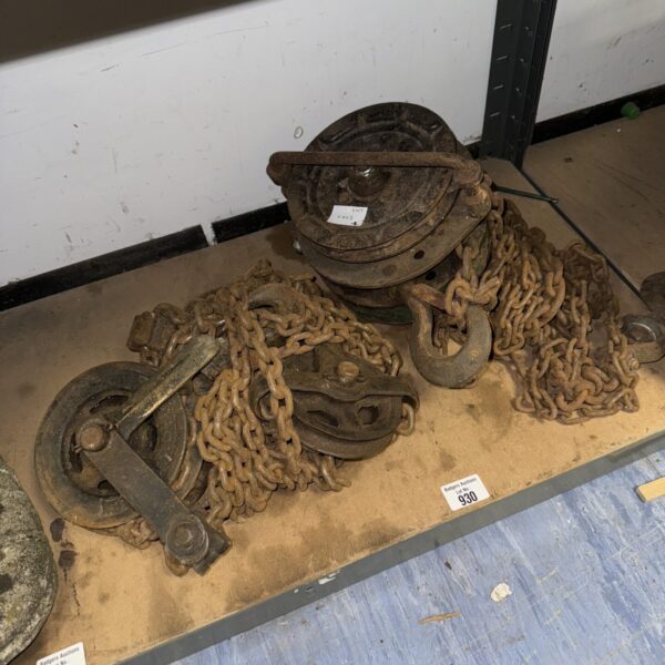 Vintage chain and pulley wheels for industrial use.