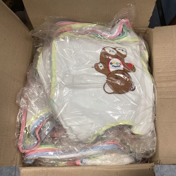 Assorted colourful baby bibs in a box.