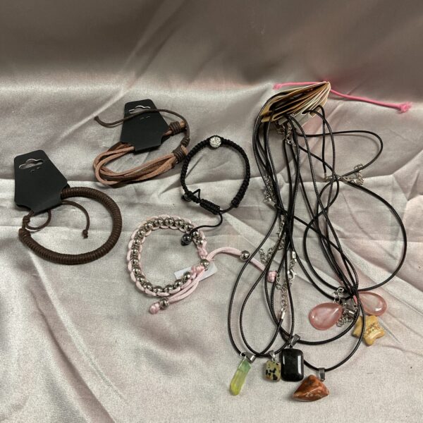 Colourful gemstone jewellery lot with necklaces and bracelets.