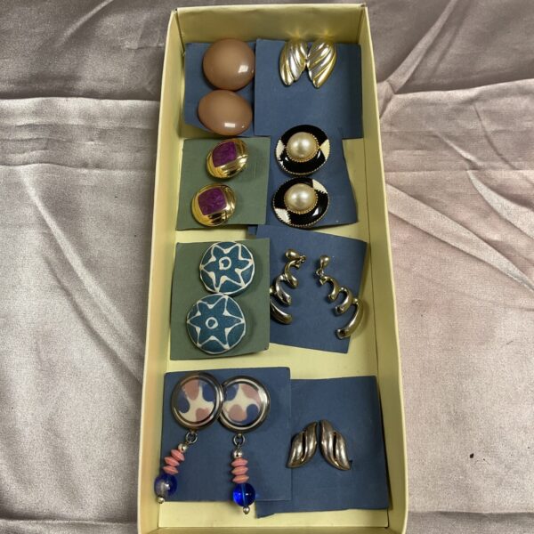Vintage earrings lot featuring colourful and gold-tone designs.