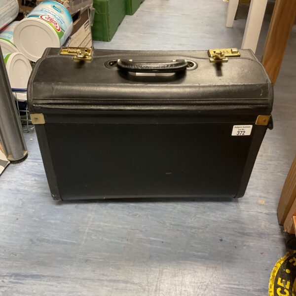 Vintage black leather pilots case with radio inside.