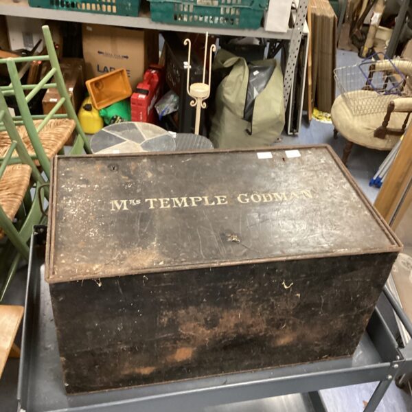 Vintage metal travel chest named "mrs Temple Godman" with wear.