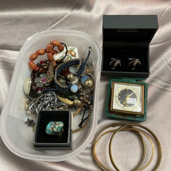 Assorted vintage costume jewellery lot with necklaces and brooches.