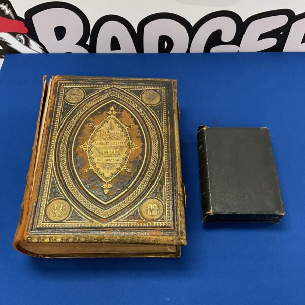 Ornate antique holy bible with gilt detailing and inscription.