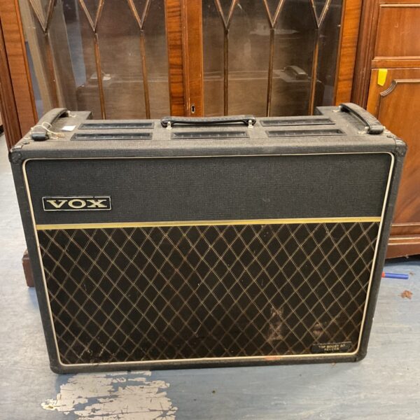 Vintage Vox speaker cabinet with two 10 inch speakers, classic guitar amp.
