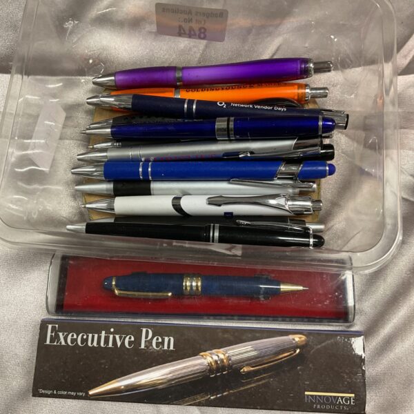 Tray of assorted pens for writing and collecting.