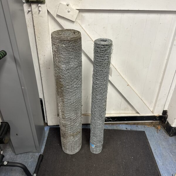 Two rolls of galvanized steel chicken wire for garden or poultry use.