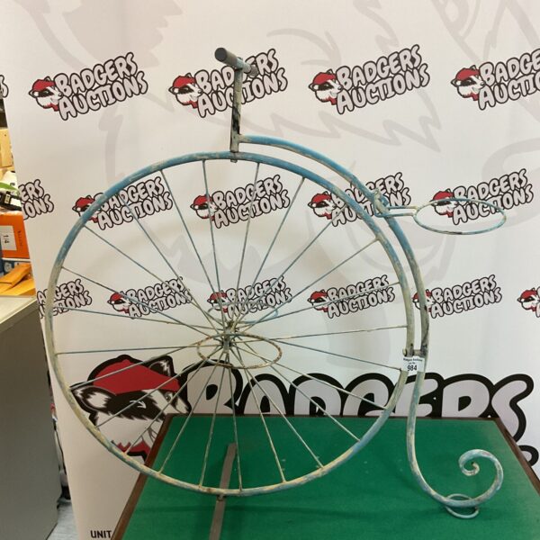 Victorian style penny farthing plant stand for garden display.