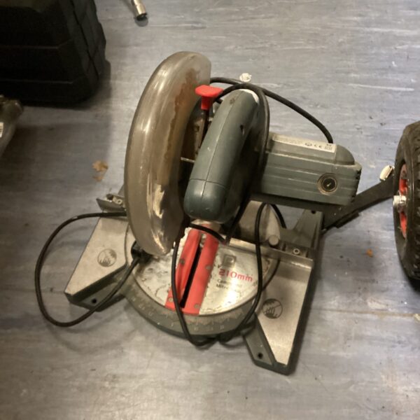 Close-up of a used mitre saw for woodworking projects.