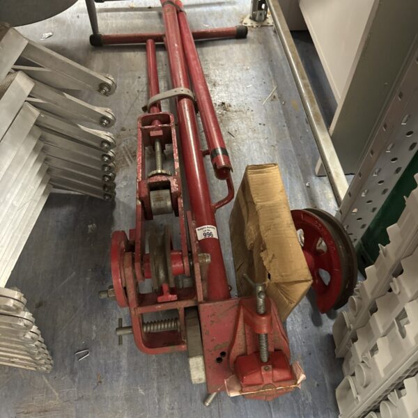 Vintage record pipe bender for metalworking and plumbing applications.