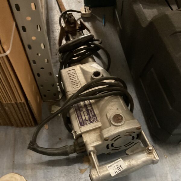 Side view of a used Kango rotary hammer power tool.