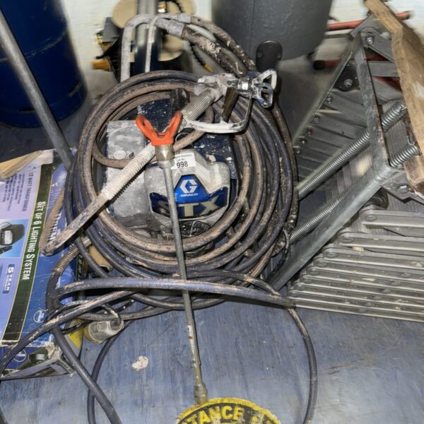 Used Graco STX airless paint sprayer with hose.