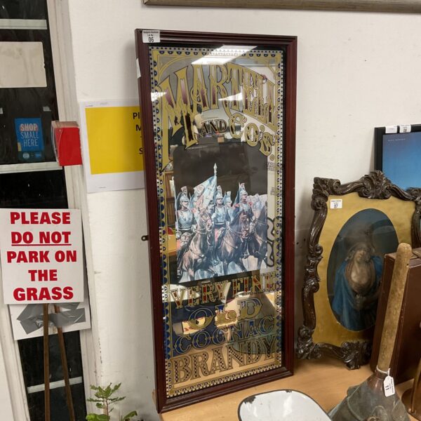 Vintage Martell cognac mirror with detailed lithograph.