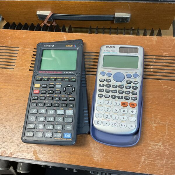 Casio CFX-9850G calculator and another unit in a lot.