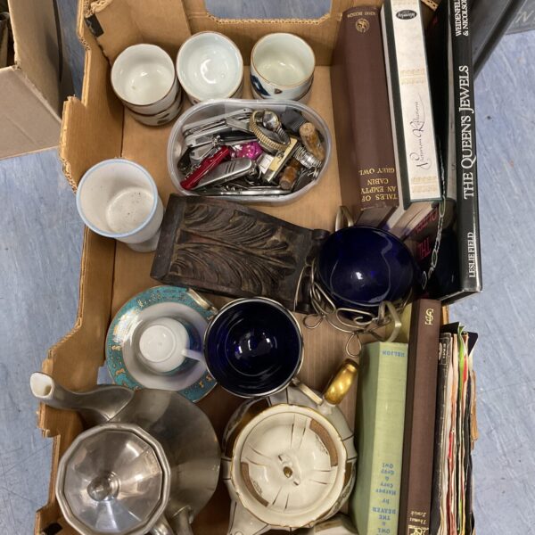 Mixed lot of vintage collectibles including watches and books.