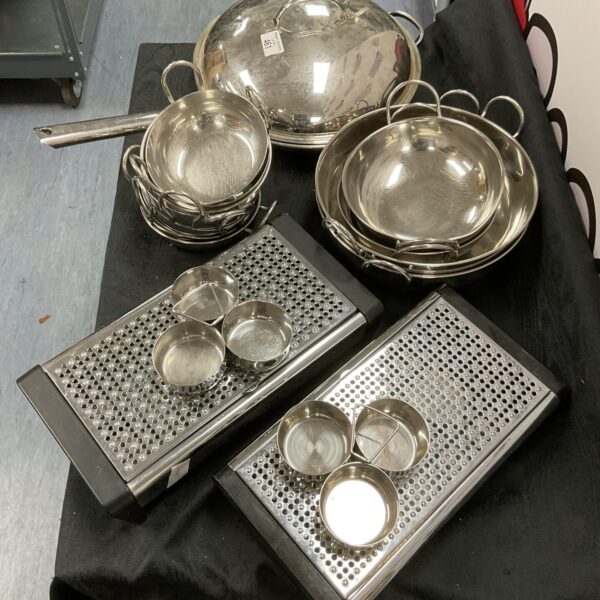 Stainless steel catering set with pan, warmers, and bowls.