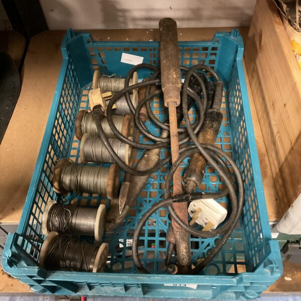 Vintage soldering irons and solder reels in a tray.