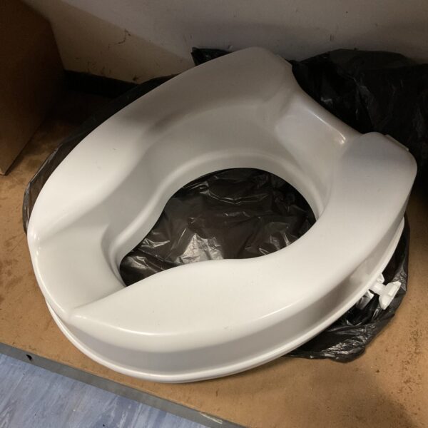Raised comfort toilet seat for bathroom accessibility and support.