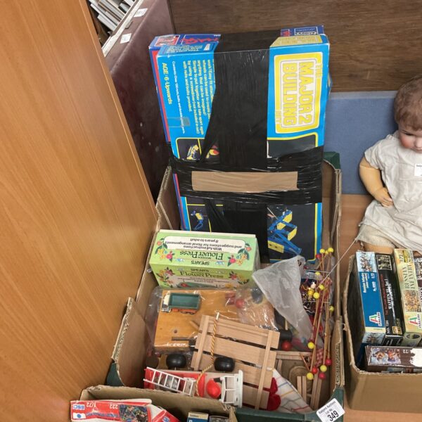 Vintage toy lot including Fisher Price items and retro toys.