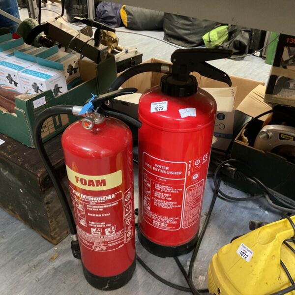 Vintage red foam and water fire extinguishers for sale.