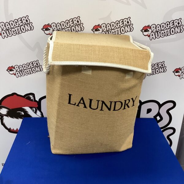 Large canvas laundry bag for clothes storage.