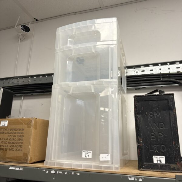 Three-tier plastic storage drawers for home organisation.