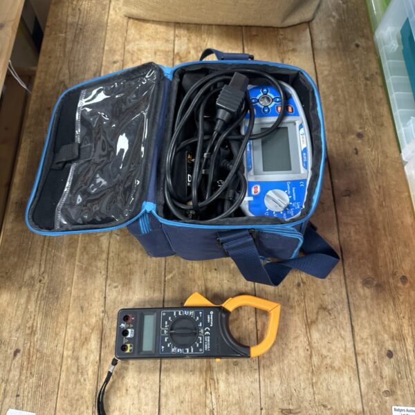 Blue carry case containing electrical testing kit with Metrel mi3002.