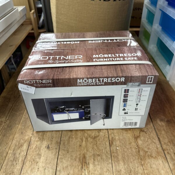 New Rottner Mobeltressor wall safe in original packaging.
