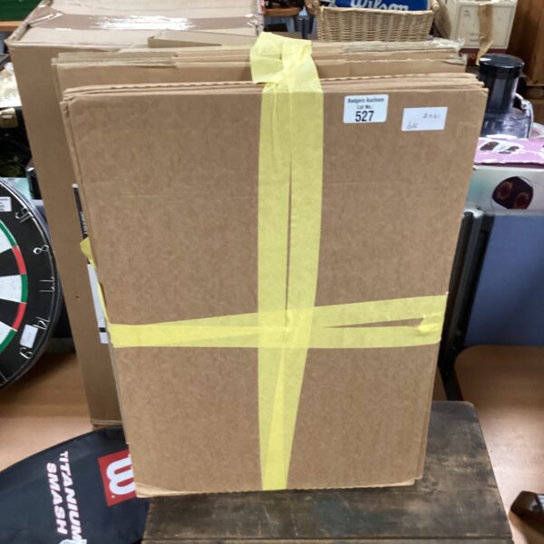 Brown cardboard storage box secured with yellow tape.