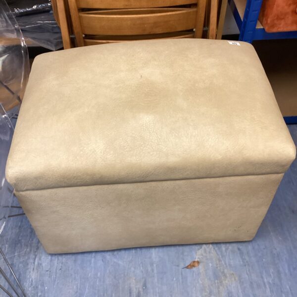 Large leather storage ottoman for living room seating and storage.