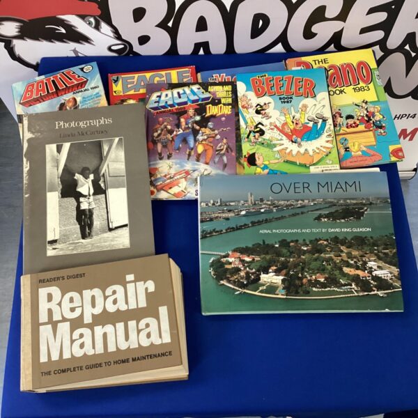 Overview of a vintage annual collection including Eagle, Battle and Beano.