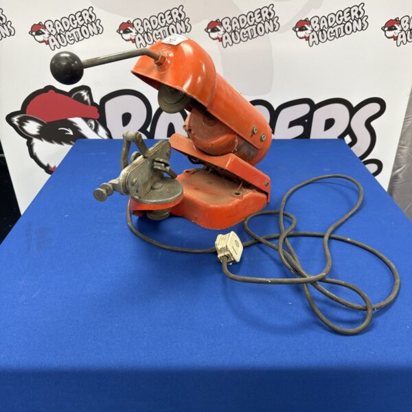 Vintage Dolmar valve grinder for engine repair and maintenance.