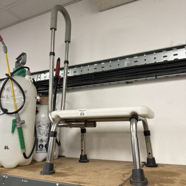 Metal adjustable height step for workshop or industrial use.