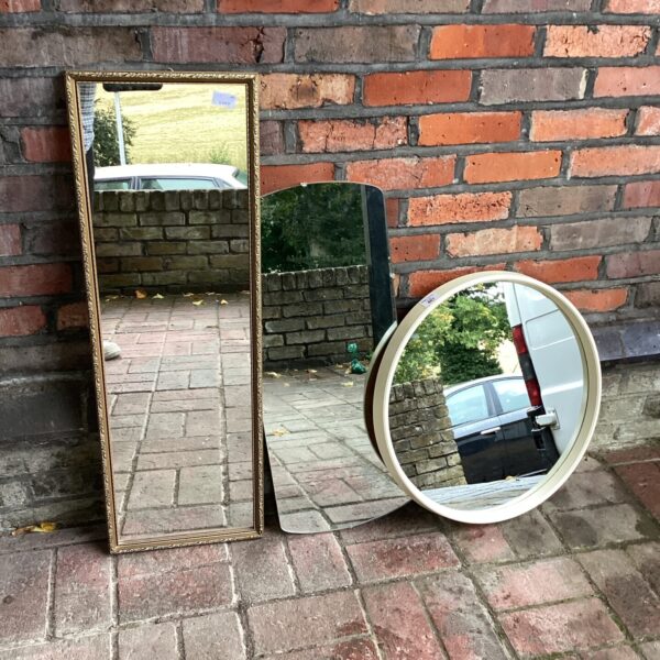 Vintage mirrors lot featuring a gilt framed mirror and round mirror.