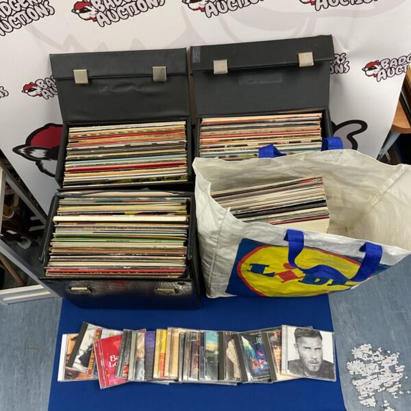Large lot of mixed vinyl records and CDs for collectors.
