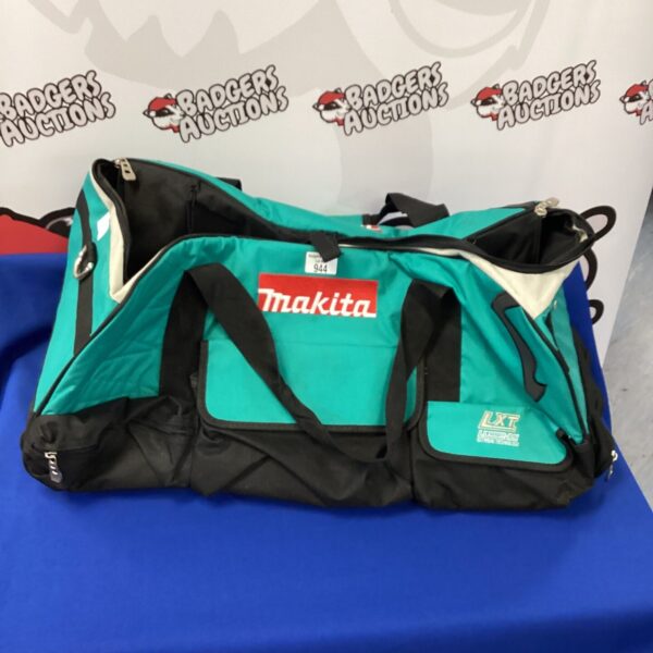 Front view of a green and black Makita tool bag.