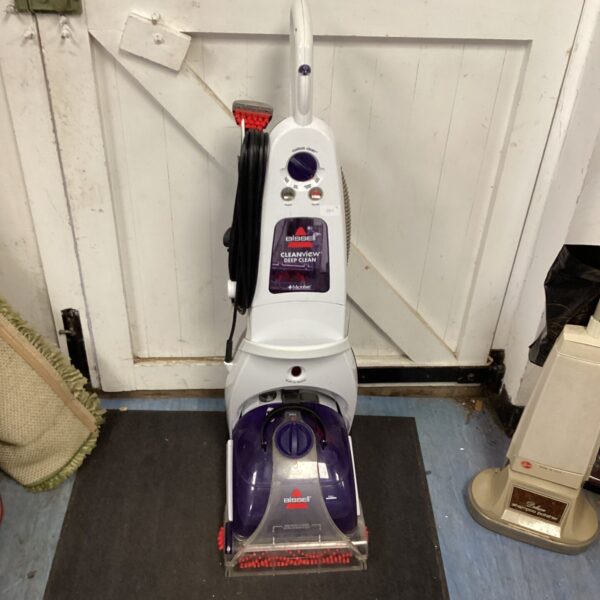 Vintage Bissell Cleanview carpet cleaner for home floor care.