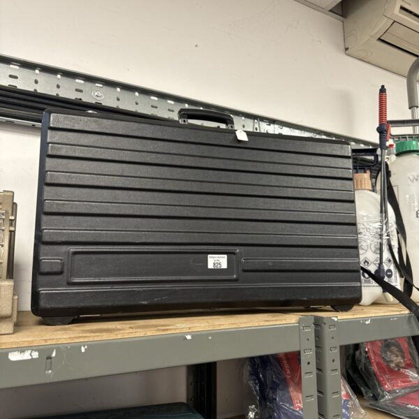 Durable 25.5 inch plastic flight case with key for secure storage.