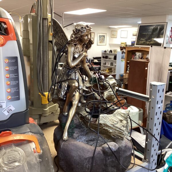 Charming resin fairy statue for a tranquil garden water feature.